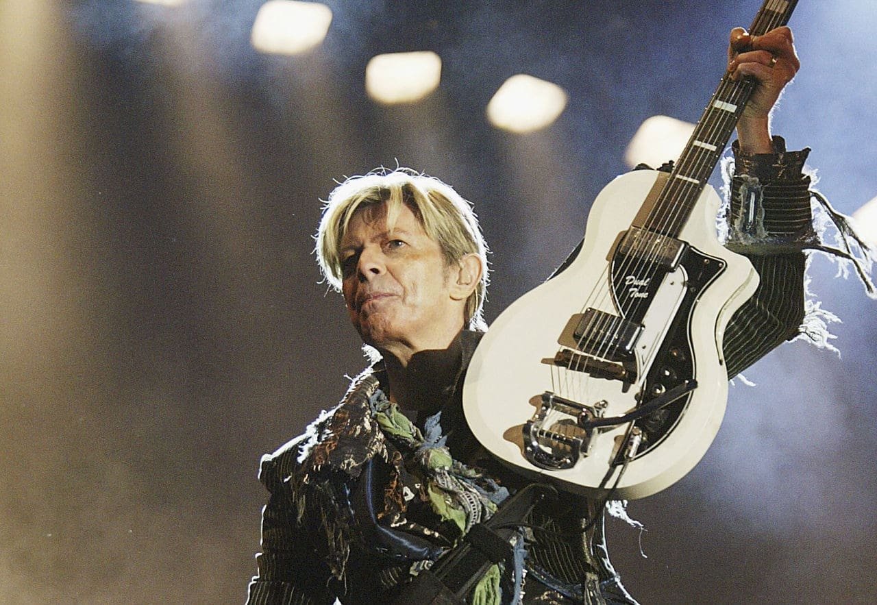 NEWPORT, ENGLAND - JUNE 13: David Bowie performs on stage on the third and final day of "The Nokia Isle of Wight Festival 2004" at Seaclose Park, on June 13, 2004 in Newport, UK. The third annual rock festival takes place during the Isle of Wight Festival which runs from June 4-19. (Photo by Jo Hale/Getty Images) 