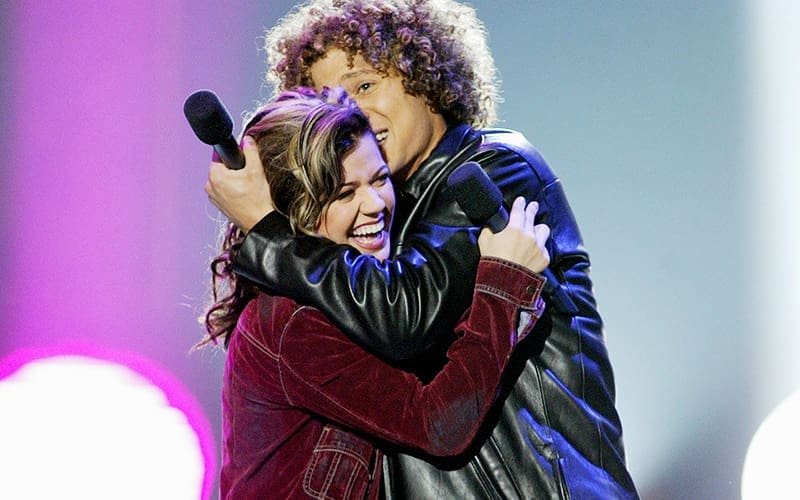 Kelly Clarkson is hugged by Justin Guarini after winning 'American Idol' on Sept. 4, 2002. ©Kevin Winter/Getty Images